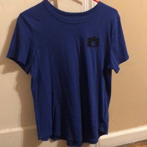 Blue short sleeve shirt.